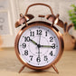 Copper double bell alarm clock with quartz dial and green luminous hour/minute markers