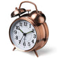 Side view double bell alarm clock with copper metal finish and quartz time dial
