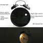 Back panel of alarm clock showing alarm switch, light switch, time knob, and AA battery slot