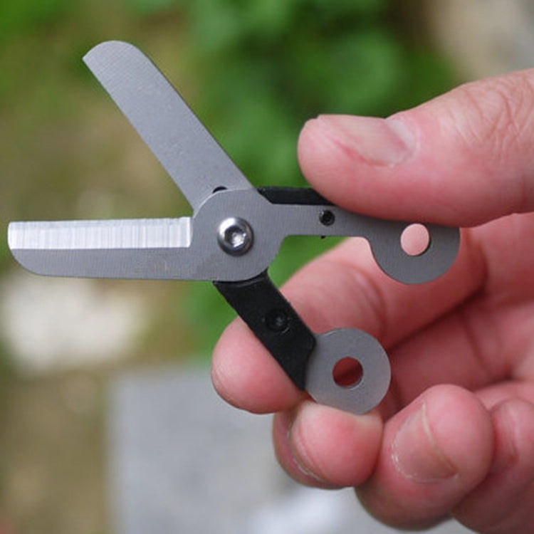 Stainless steel mini scissors with finger loop, open blades in metallic gray and black