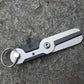 Stainless steel mini scissors keychain tool with round ring and dark black panel accents