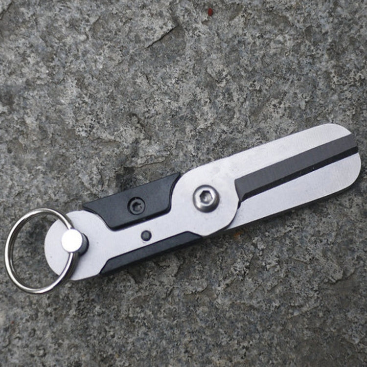 Stainless steel mini scissors keychain tool with round ring and dark black panel accents