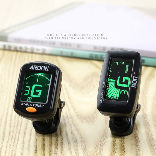 Set of two black clip-on electronic tuners with green LED displays and clips