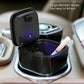 Opened black car ashtray with cigarette holder slot and glowing indicator light