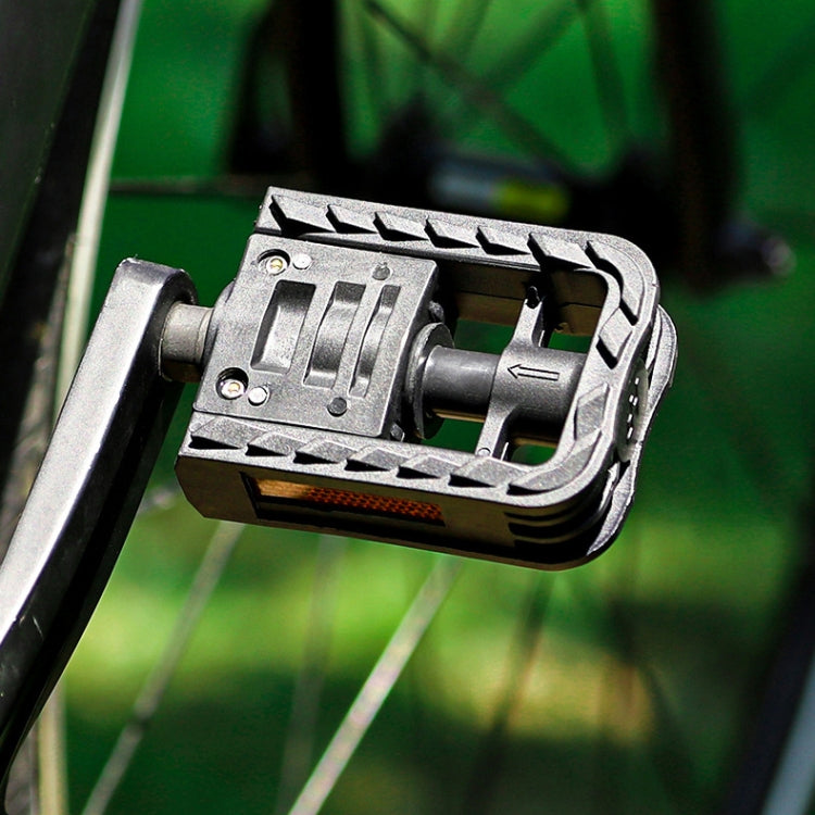 Folding bicycle pedal with ball axle and metal crank arm, black and silver close-up