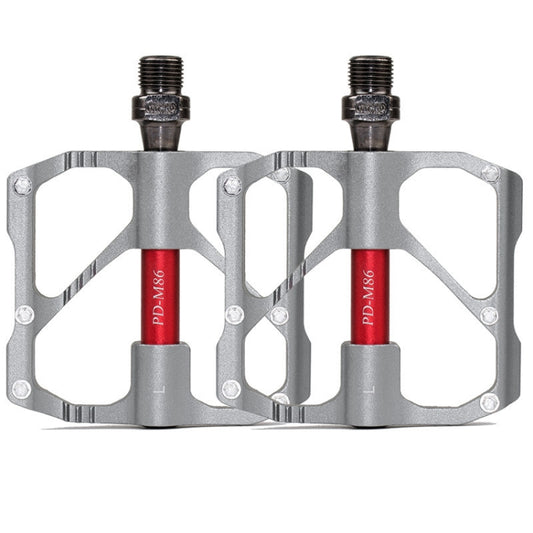 PROMEND aluminum bicycle pedals pair, gray platform with red axle covers and pins