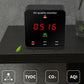 Portable air quality monitor screen with red 0.5/1.6 readings and AQI/CO2/TVOC icons