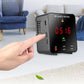 Portable air quality monitor with hand pointing at side controls and red 0.5/1.6 display