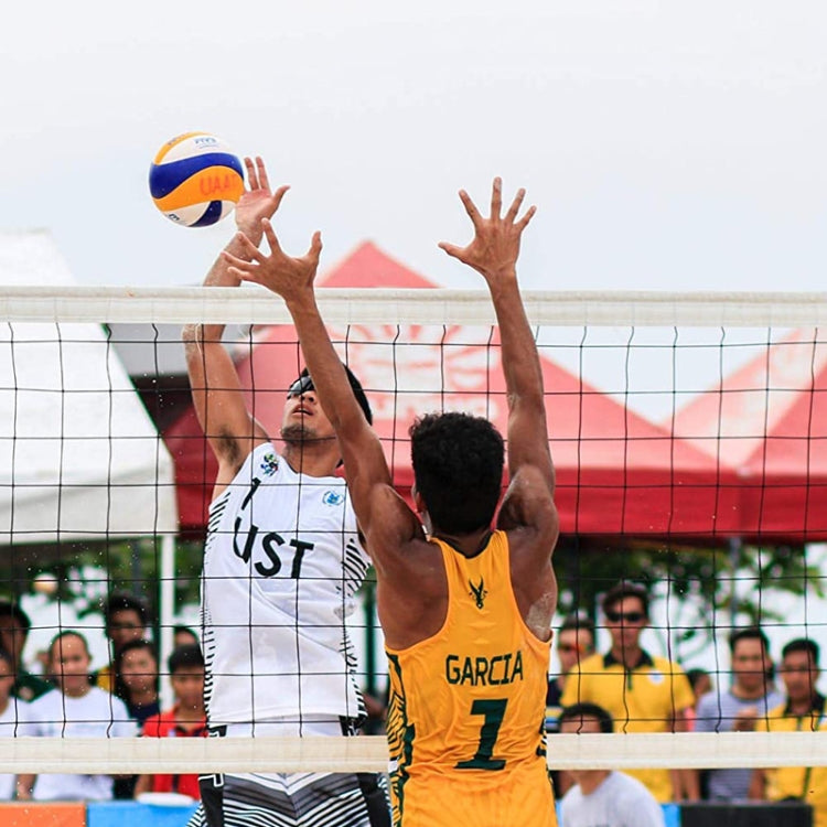 Volleyball net stretched across the court as players reach to spike