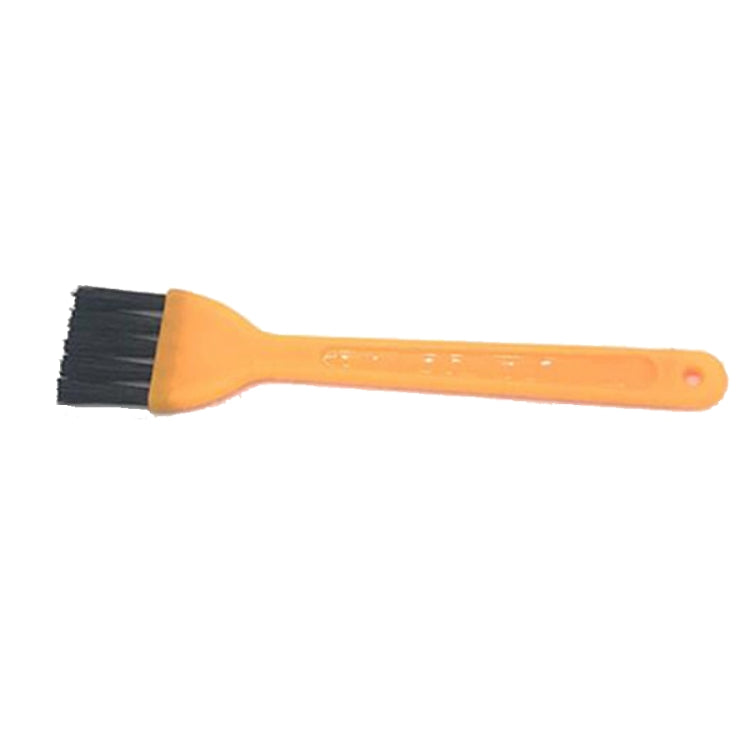 Robot vacuum filter cleaning brush with orange handle and black bristles
