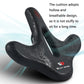 Black bicycle saddle with center cutout, eagle pattern, and breathable red vent dots.