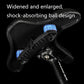 Close-up of black bicycle saddle with shock-absorbing blue spring dampeners and bracket.