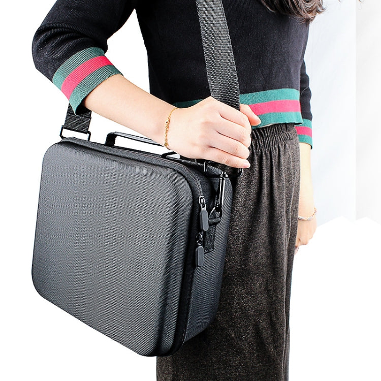 Person carrying gray hard shell storage bag by the shoulder strap