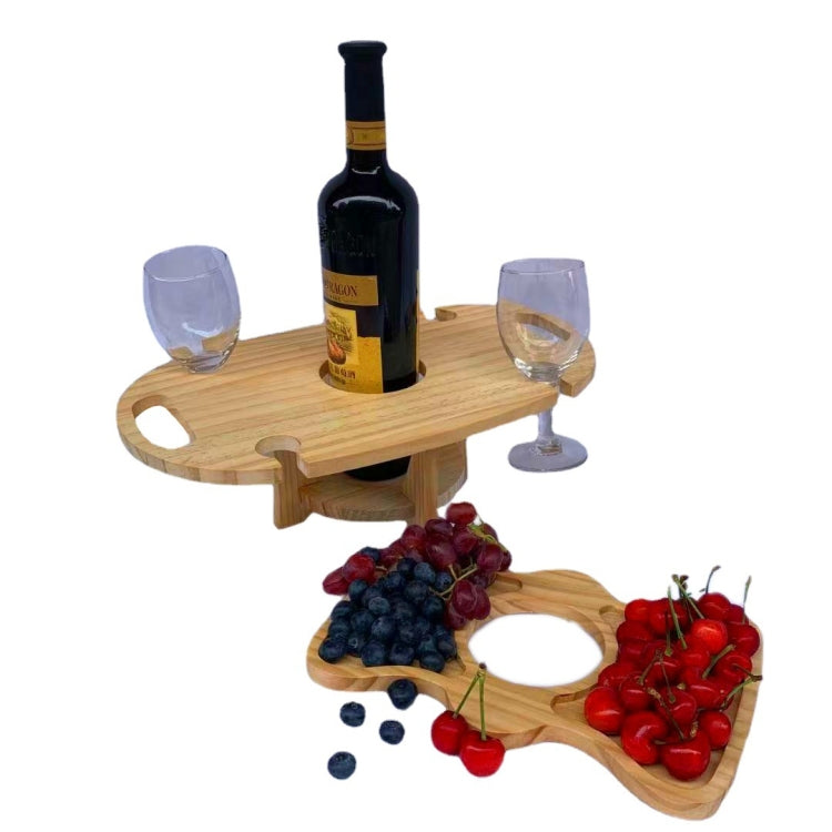 Wooden foldable wine rack picnic table with wine bottle, two glasses, and fruit
