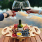 Wooden foldable wine rack picnic table with bottle, grapes, and sliced food