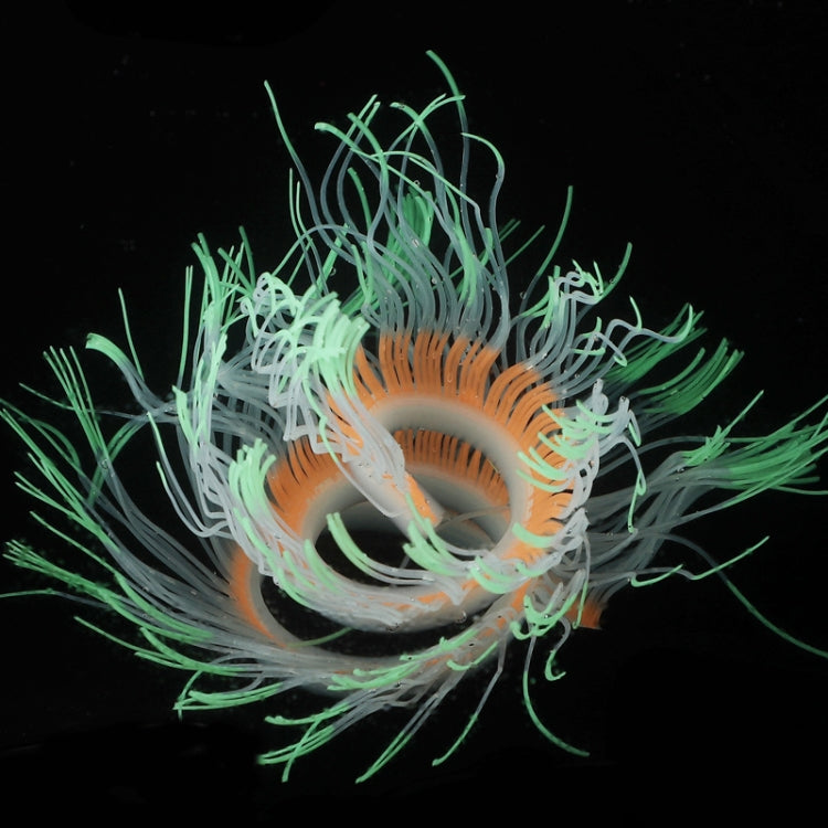 Fluorescent simulated coral anemone with light blue tentacles and orange ring center