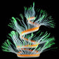 Fluorescent simulated coral anemone with blue tentacles, green tips, and orange accents