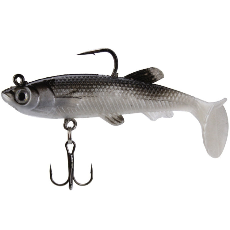 Silver fishing lure with clear white tail, black top hook and treble belly hook.