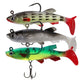 Set of three fishing lures: gray, silver, and green with red tails and hooks.