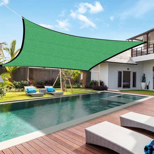 Green shading net sunshade panel, stretched on balcony for outdoor shade