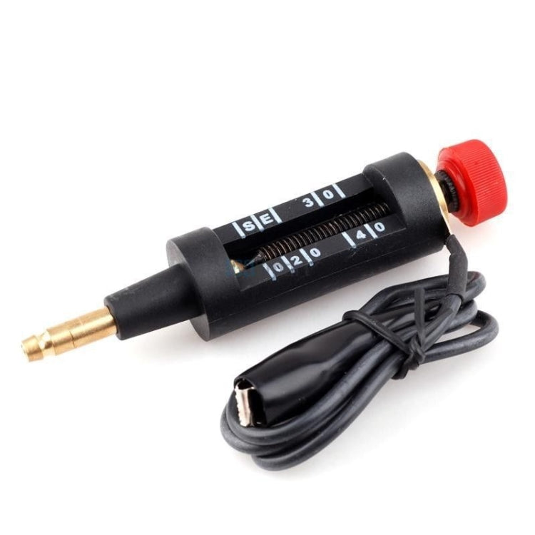 Black spark plug test pen with red cap and black coiled cable