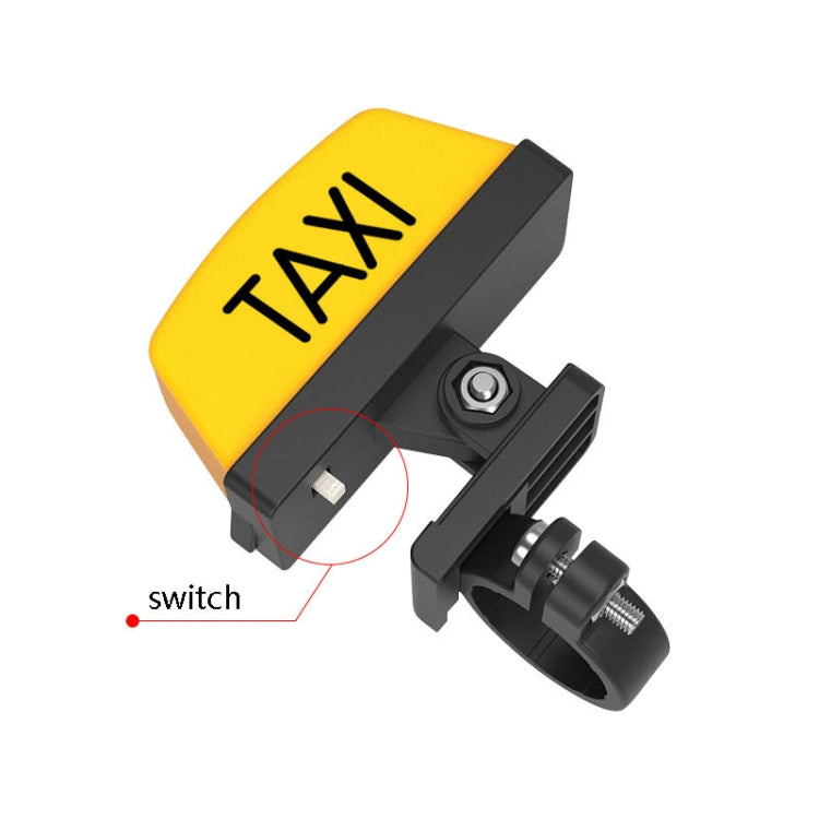 Yellow TAXI motorcycle warning light with black bracket and visible switch control