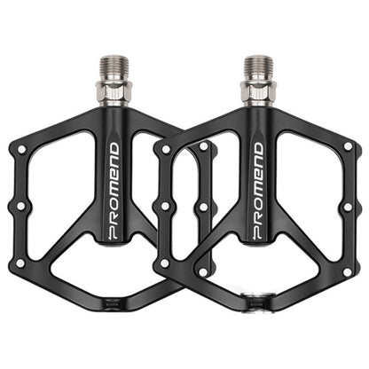 Pair of black aluminum bicycle platform pedals with threaded studs and axle bearings