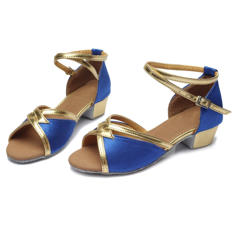 Blue and gold low-heel dance shoes with ankle strap and soft sole.