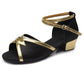 Black low-heel dance shoes with gold trim, ankle strap, and open toe