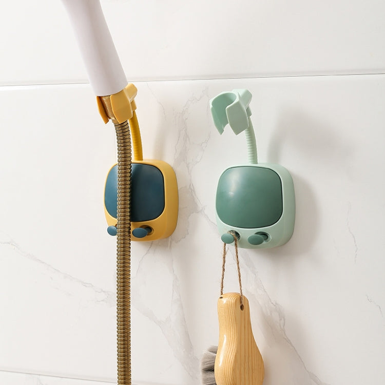 Wall-mounted shower head holders in yellow and mint green with flexible hoses and loofahs