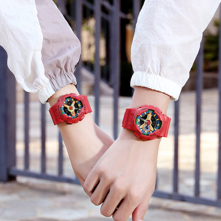 Red waterproof luminous sport watch on wrist with black dial and rugged strap