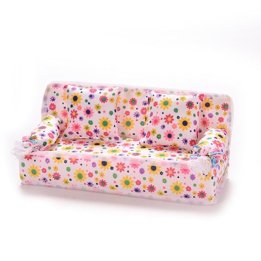 Mini dollhouse fabric sofa with floral upholstery and two back cushions, angled view