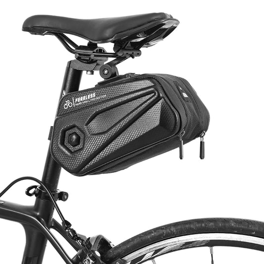 Black hard-shell bicycle tail bag with adjustable seat bracket, mounted on saddle.