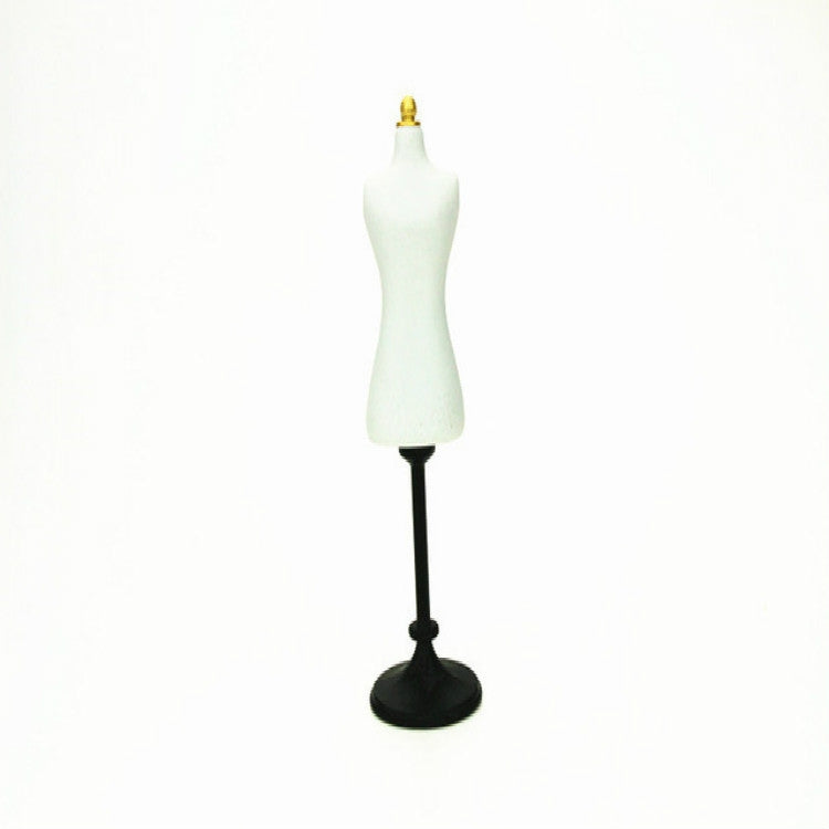 Mini white dress form mannequin with gold top and black round base for dollhouse scale