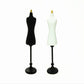 Set of two miniature mannequins: black and white dress forms with gold tops and bases