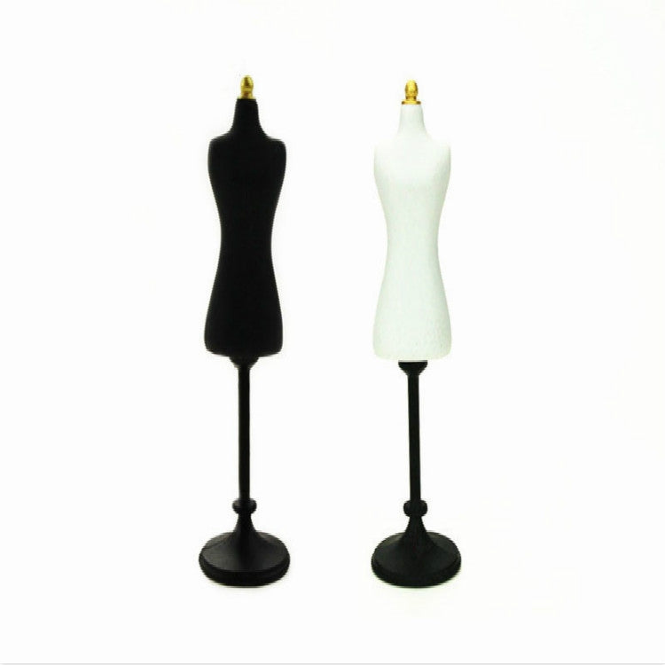 Set of two miniature mannequins: black and white dress forms with gold tops and bases