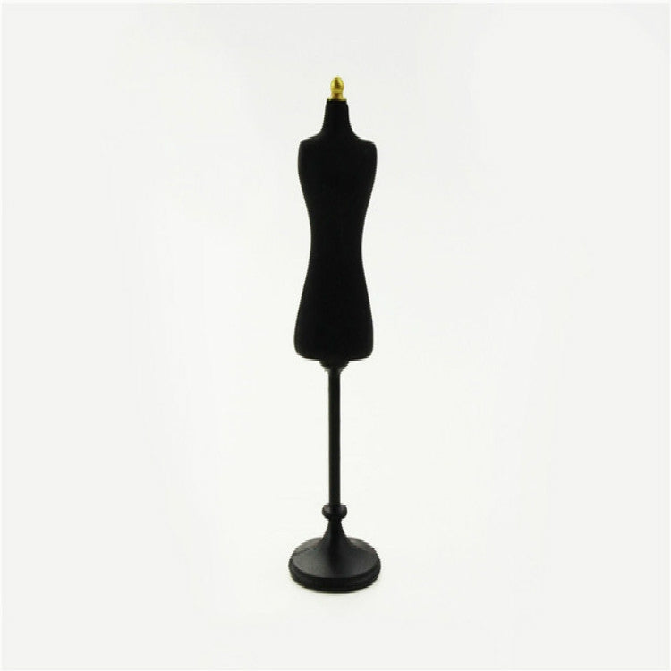 Mini black dress form mannequin with gold top and black round base for dollhouse display