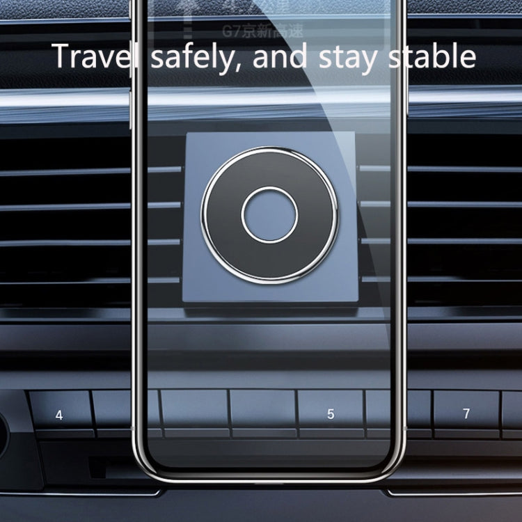 Magnetic phone holder disc mounted in car air vent, black with silver ring
