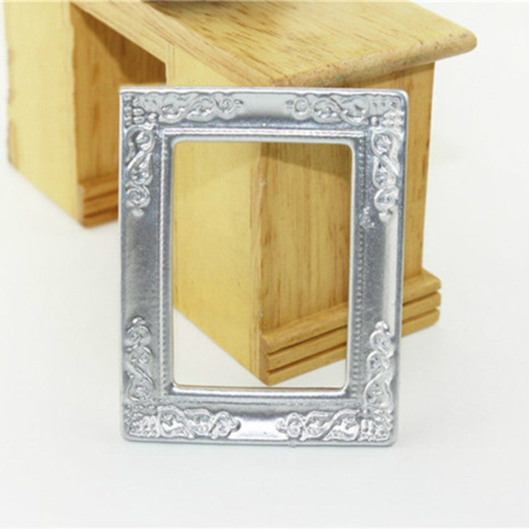 Miniature silver dollhouse decorative picture frame with ornate border and empty window