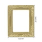 Miniature gold dollhouse picture frame with ornate border and size markings