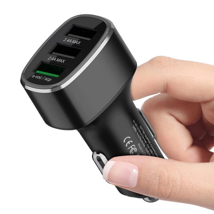 Car USB car charger with three ports, hand plugging into car socket