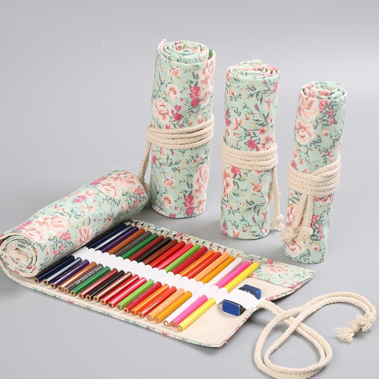 Floral canvas pen roll with colored pencils, rolled sleeves and beige drawstring.