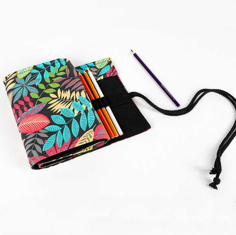 Opened leaf-pattern pen roll case with pencils inserted and black holder flaps