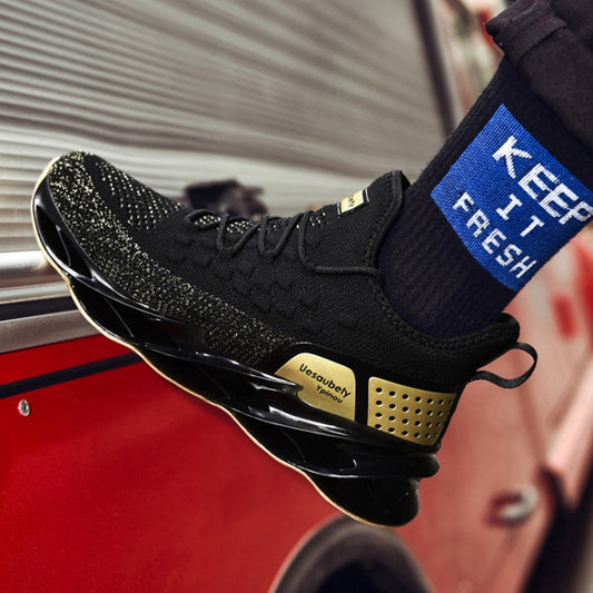 Men's black lace-up sports sneakers with gold perforated side detail and bouncy sole