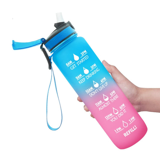 Gradient Tritan sports water bottle with blue lid, attached strap, held in hand