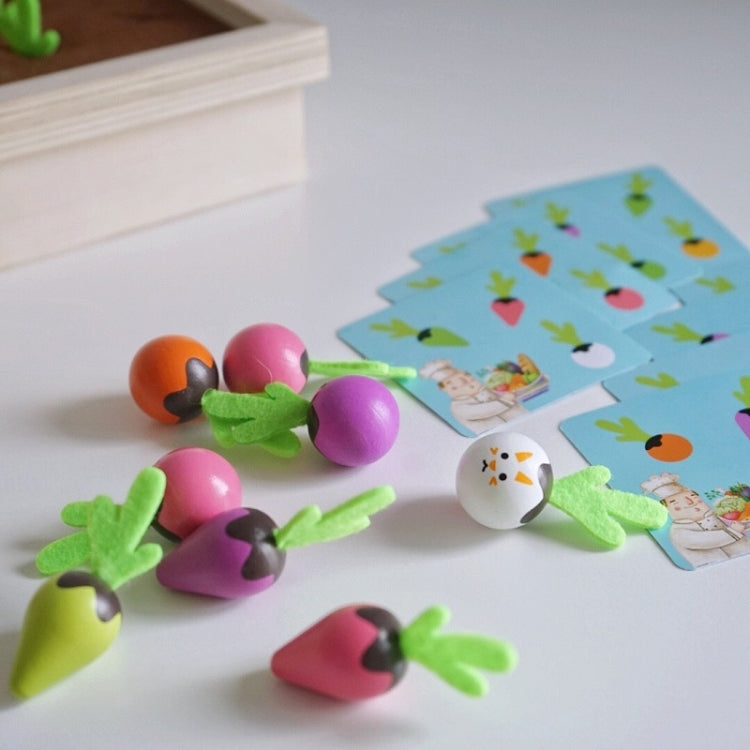 Carrot memory chess pieces with green bases and animal tiles beside picture cards