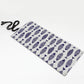 Rolled canvas pencil case with blue-and-white fish print and black tie cord