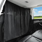 Black car privacy curtain panel with gathered pleats installed inside vehicle