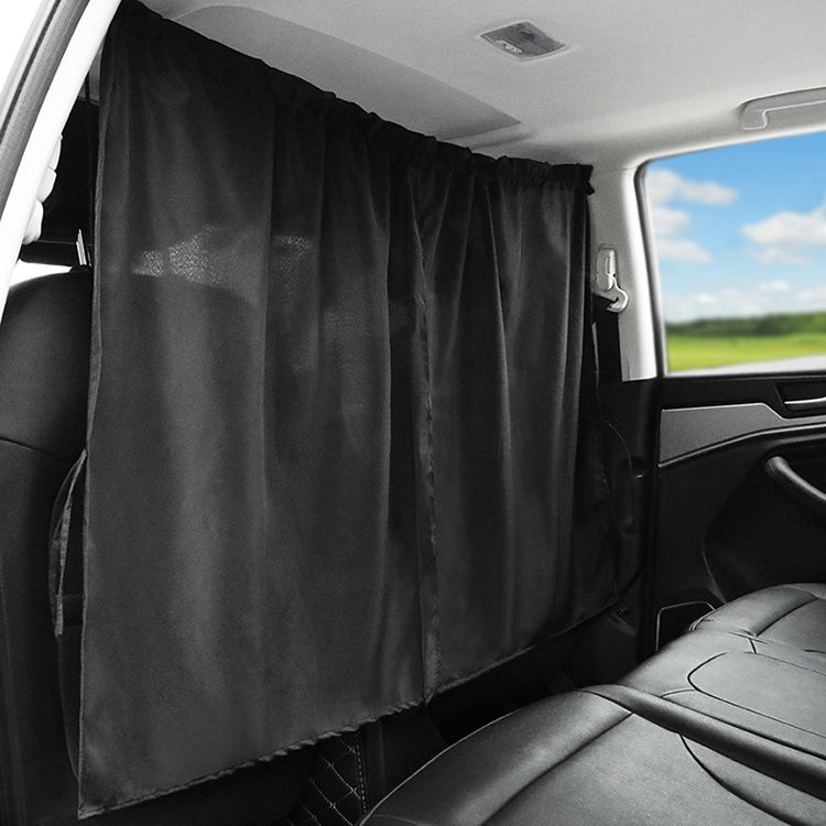 Black car privacy curtain panel with gathered pleats installed inside vehicle