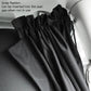 Black privacy curtain with strap detail and pleated fabric on car seat